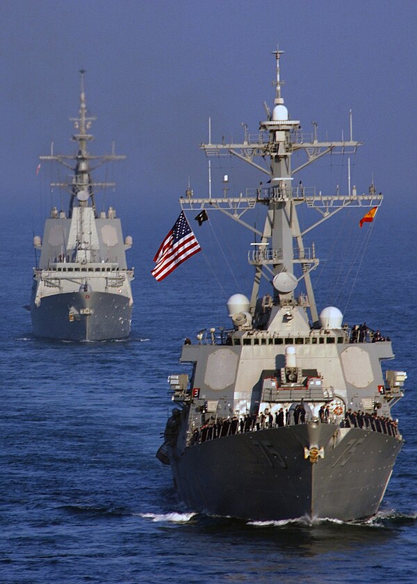 The two competing designs for the Australian AWD project: Arleigh Burke-class destroyer USS Donald Cook leading Álvaro de Bazán-class frigate Álvaro d