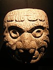 A Chavin stone sculpture in the shape of a head of a man, an ornament from a wall; 9th century BCE; Museo de la Nación (Lima, Peru)