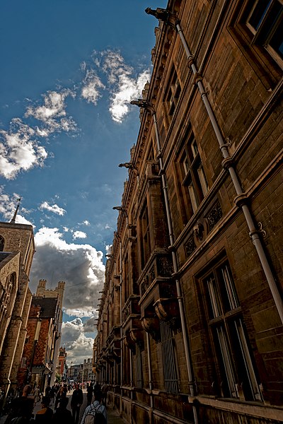 File:Cambridge - Trinity Street - View SSW along Gonville & Caius College 1876 by Alfred Waterhouse (who in 1881 designed the Natural History Museum in London).jpg