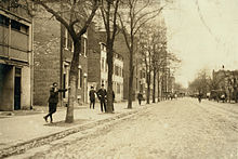 This area of Pennsylvania Avenue in Washington, D.C. was known from the mid-1800s to the 1920s as "Murder Bay," home to numerous brothels. The youth on the left was a "procurer". Child brothel worker - C Street NW Washington DC - April 1912.jpg