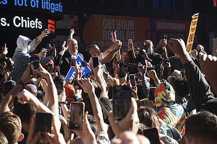 Senator Chuck Schumer addresses a crowd celebrating in Times Square, New York City shortly after the election was called for Biden.