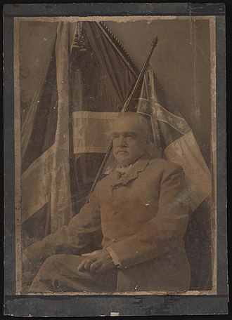 Confederate veteran Private Clark Robertson Starnes of Co. C, 1st North Carolina Cavalry Regiment in uniform with medals and Confederate flags. From the Liljenquist Family Collection of Civil War Photographs, Prints and Photographs Division, Library of Congress Civil War veteran Clark Robertson Starnes LCCN2017660601.jpg