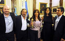 President Cristina Fernandez with the film director Juan Jose Campanella and the cast of The Secret in Their Eyes (2009) with the Oscar for Best Foreign Language Film Cristina, elenco y Oscar.jpg