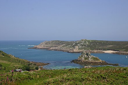 View NE from Bryher, over Fraggle Rock and channel to Cromwell's Castle on Tresco