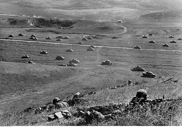 German tanks in formation in a Caucasus valley with infantry in the foreground, September 1942