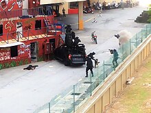 The Malaysian Army's 21st Special Service Group assaulting a building using an assault ladder during a unit demonstration DSA 2016 - Close Quarters Battle.jpg