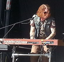 Reed playing with The Dead Daisies in 2013. Dead Daisies (cropped).jpg
