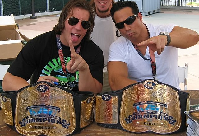One-time champions Deuce 'n Domino (right and left), shown here with the original design of the championship (2002–2010) when it was still known as th