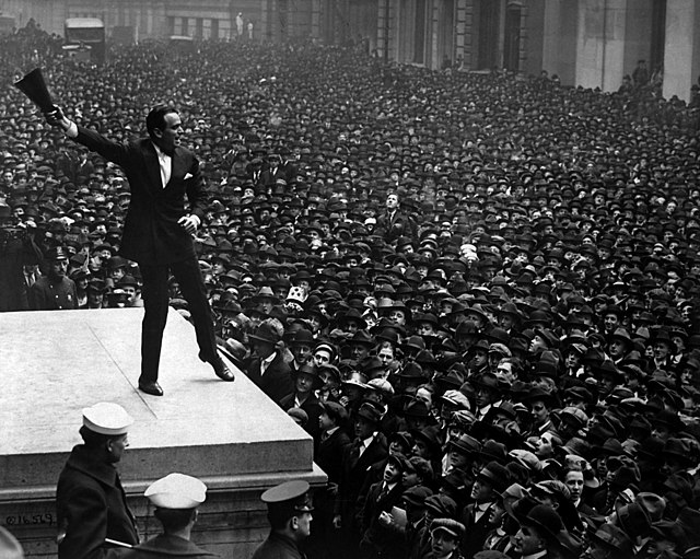 Fairbanks speaking in front of a crowd at a 1918 war bond drive in New York City