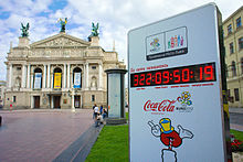 A clock in Lviv on Prospekt Svobody (Freedom Ave.), showing time to start of EURO 2012. Opera and Ballet Theatre in background EURO 2012 Lvov clock.jpg