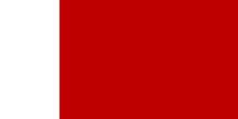 A red flag with a white stripe on the left, or hoist, side, about 1/5 the width of the flag