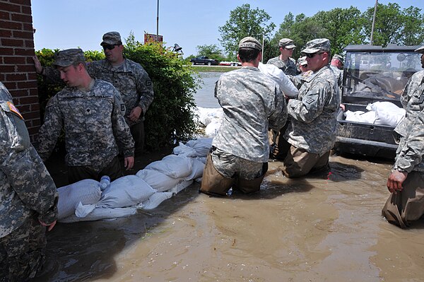 Arkansas National Guardsmen helping fight flood waters in the small community of Payneway, May 2011