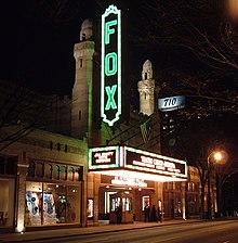 The Fox Theater in Atlanta has an old-fashioned neon sign. Fox Theater night.jpg