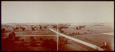 Gettysburg Battlefield, circa 1903, looking south along Cemetery Ridge and Hancock Avenue. The Equestrian Statue of General George Gordon Meade (1895) is left of center; the field of Pickett's Charge is right. Gettysburg Battlefield circa 1903.jpg