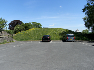 Remnant of motte of Great Torrington Castle. The bowling green beyond occupies the site of the former bailey GreatTorringtonCastle Motte Devon.PNG