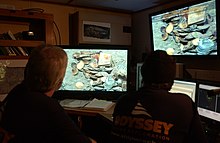 Gregory Stemm, co-founder of Odyssey Marine Exploration, along with an archaeologist exploring a shipwreck site Greg Stemm in Online Room .jpg