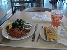 A meal served with lingonberry juice. IKEA food (8553993912).jpg