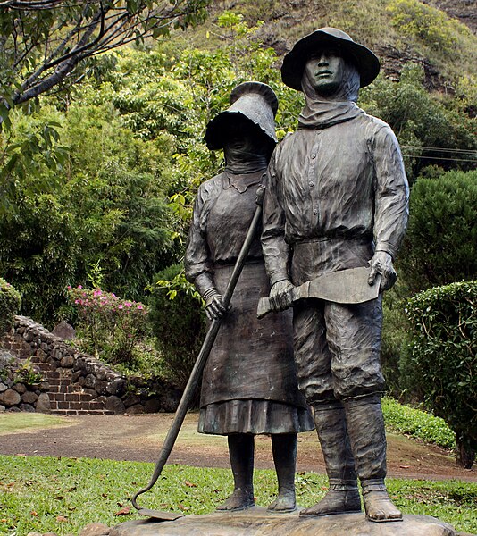 Bronze statue of Japanese sugarcane workers erected in 1985 on the centennial anniversary of the first Japanese immigration to Hawaii in 1885.