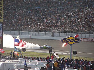 Jimmie Johnson doing a burnout after winning the 2006 UAW-DaimlerChrysler 400. Jimmie Johnson Las Vegas Win 2006.jpg