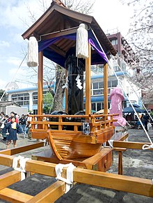 Steel and fiberglass phallus mikoshi (parade floats) (in the foreground and back right, respectively) at Kanamara Matsuri in Kawasaki, Japan. These are two of the three matsuri carried in the festival. Kanamara-mikoshi2.jpg
