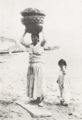 Korean carrying loads on her head (from a book Published in 1931) P.82.png
