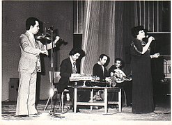 Haydeh, Loghman Adhami, and other musicians at a concert.