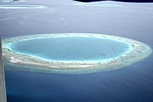 Subsided island leaves a coral lagoon in the Maldives Maldives small island.jpg