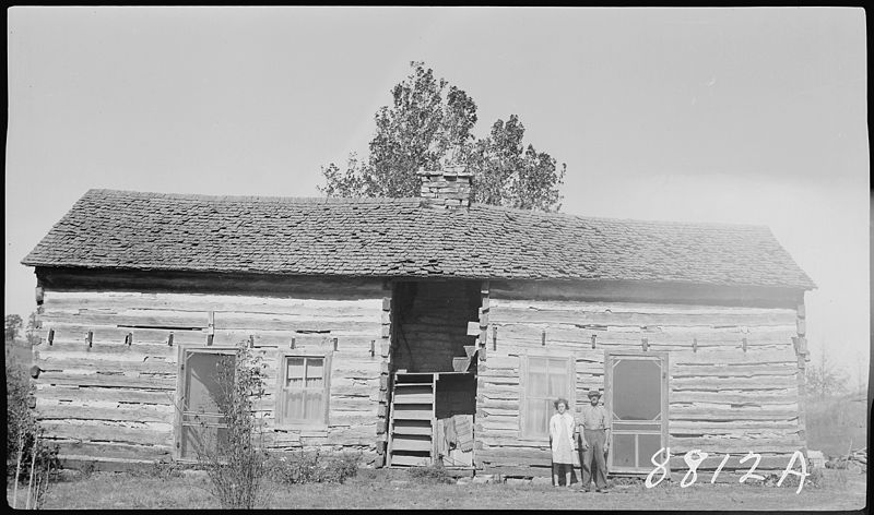 File:Mc Phail farm, 90 year old log house, family in front of home - NARA - 281074.jpg