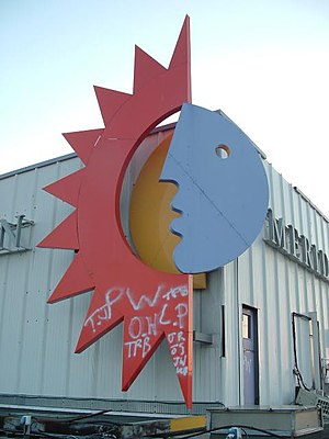 Meridian Logo on the side of their studios with graffiti on the bottom of the logo