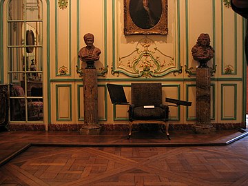 The armchair of Voltaire, where he spent his last hours, in the Salon of the residence of the Marquis de Villette