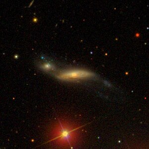 SDSS image of the neighboring galaxies NGC 2735 and NGC 2735A (left), which together form Arp 287.