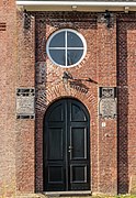 Nederlands Hervormde Kerk (Terkaple) Entrance portal with gable stones.