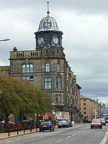 The former Leith Provident Co-operative building at the west end of Great Junction Street has a distinctive domed octagonal clock tower, forming a major landmark. Old Leith Provident building, Great Junction Street (geograph 2643796).jpg