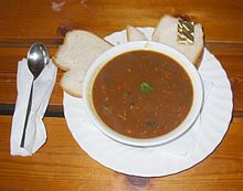 Des pais au fou - bean crock, accompanied by slices of cabbage loaf Pais au fou, Jersey bean crock.jpg