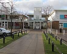 Pathway to 1999 iteration of Wrexham Central railway station, within the retail park, situated between two retail stores Path to Wrexham Central railway station (geograph 5672770).jpg