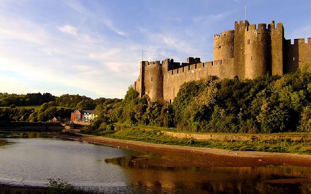 Pembroke Castle today. The original castle, of which no above-ground trace remains, was built by Arnulf of Montgomery (c.1066 – 1118/22), the Anglo-No