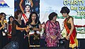 * Nomination Penampang, Sabah: Ms. Samantha Sharon C.E. Laujang, receiving the subsidiary title of "Tati Topiodo" (Miss Friendly) from YBhg Puan Sri DSP Genevieve Datuk Kitingan during Unduk Ngadau Charity Dinner --Cccefalon 05:03, 26 March 2015 (UTC) * Promotion Good quality. --Livioandronico2013 09:11, 26 March 2015 (UTC)