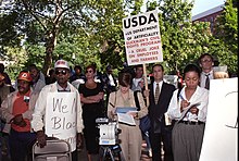 In 1997, hundreds of people rallied outside Lafayette Park to address the systemic racial discrimination that occurred within the USDA. The group pushed for changes to address the issue. Protestors who rallied outside Lafayette Park in class-action lawsuit against USDA in 1997.jpg