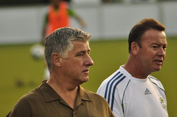 Schmid and a member of his staff before a 2010 U.S. Open Cup match