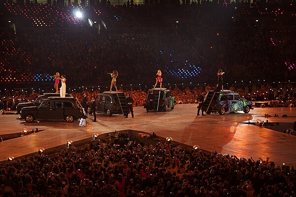 The Spice Girls performing "Spice Up Your Life" on 12 August 2012, standing on the roofs of London cabs at the London Stadium for the Summer Olympics 