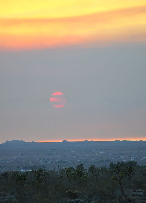 Haze as smoke pollution over the Mojave from fires in the Inland Empire, June 2016, demonstrates the loss of contrast to the Sun, and the landscape in