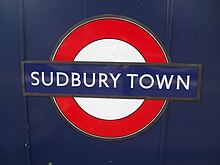 The wedge-serif variation of the font, as seen at Sudbury Town Underground station Sudbury Town stn roundel.JPG