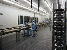 The superconducting resonators used in the linear accelerators of the free-electron laser FLASH and the European XFEL X-ray laser are processed and assembled in a cleanroom. TTF Cavity-Verbindung im Reinraum 2-a3.jpg