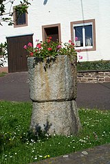 Baptismal font and wayside cross