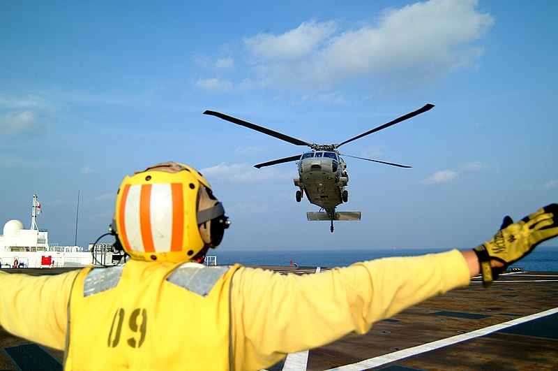 File:US Navy 050224-N-0357S-103 A Landing Signal Enlisted (LSE) guides a MH-60S Seahawk helicopter, assigned to Helicopter Combat Support Squadron Five (HC-5), for a landing aboard the Military Sealift Command (MSC) hospital ship U.jpg