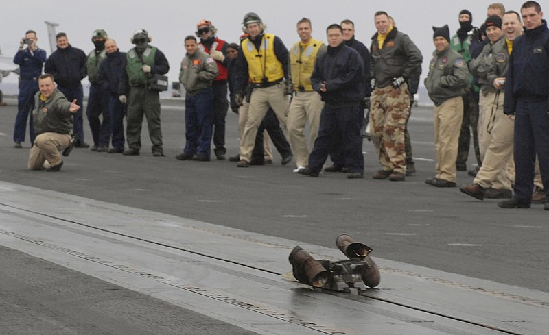 File:US Navy 070121-N-5345W-061 Lt. Cmdr. Robert Stark holds his shoot stance while his boots speed down catapult number one during a boot shoot ceremony on the flight deck of the Nimitz-class aircraft carrier USS Harry S. Truman (C.jpg