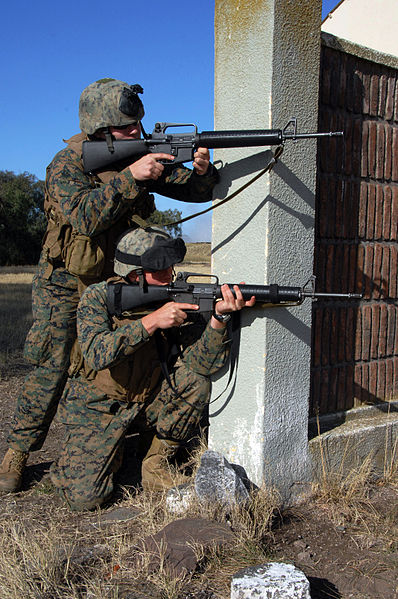 File:US Navy 090630-A-1839I-086 Cpl. Joseph Wiedel and Cpl. Mathew Ingle, both assigned to the 2nd Marine Expeditionary Force (2nd MEF), prepare to demonstrate running from corner to corner.jpg