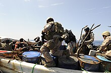 Members of the U.S. Coast Guard Law Enforcement Detachments and Combined Task Force 151's conduct VBSS operations from USS Farragut (DDG-99) board a suspicious boat US Navy 100331-N-8959T-044 Members of the U.S. Coast Guard Law Enforcement Detachment and Combined Task Force 151's visit board search and seizure team..jpg