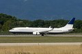 -900 BBJ3, side, vegetation behind