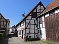 Stand construction and side extension in half-timbered construction